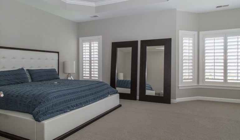 Polywood shutters in a minimalist bedroom in Clearwater.